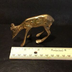 Brass sculpture of spotted yearling deer